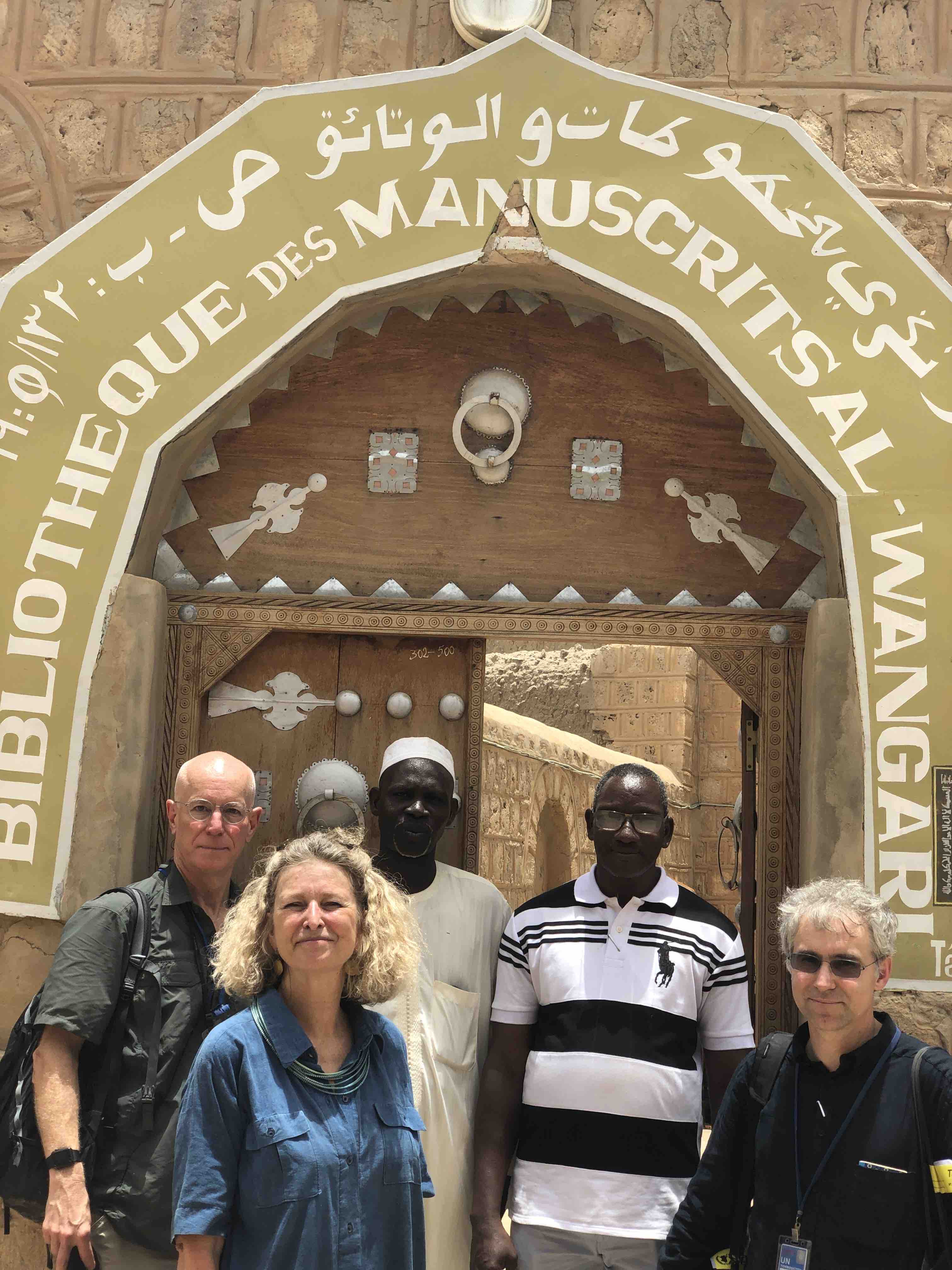 HMML Executive Director Fr. Columba Stewart, OSB, and Project Director (Djenné and Timbuktu) Sophie Sarin, with partners at the Al-Wangari Library, Timbuktu